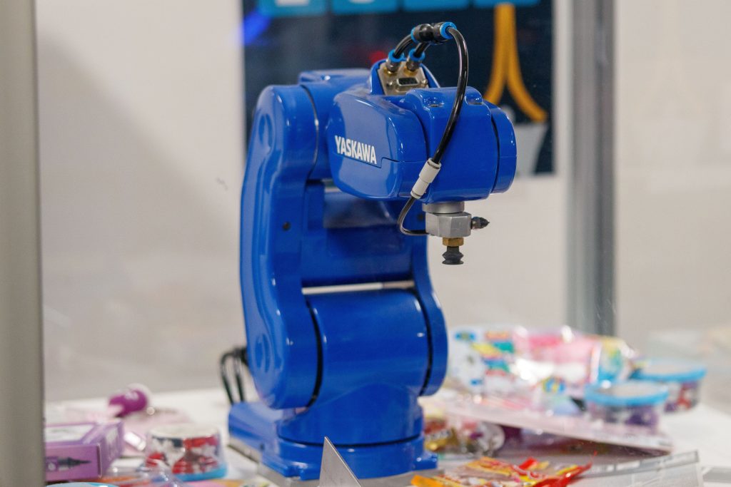 4. A blue Yaskawa industrial robot arm on display, showcasing advanced technology and robotics